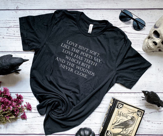 Love isn't soft, like the poets say. Love has teeth which bite and the wounds never close - Stephen King Quote -  T-Shirt